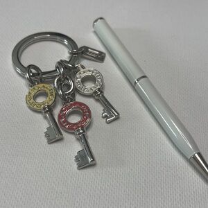 Silver Coach Keychain with Key Charms and Coach Pen